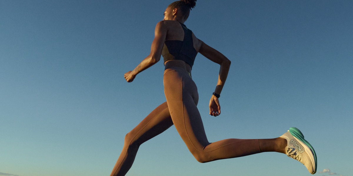 woman running in Hoka Machx2 shoes